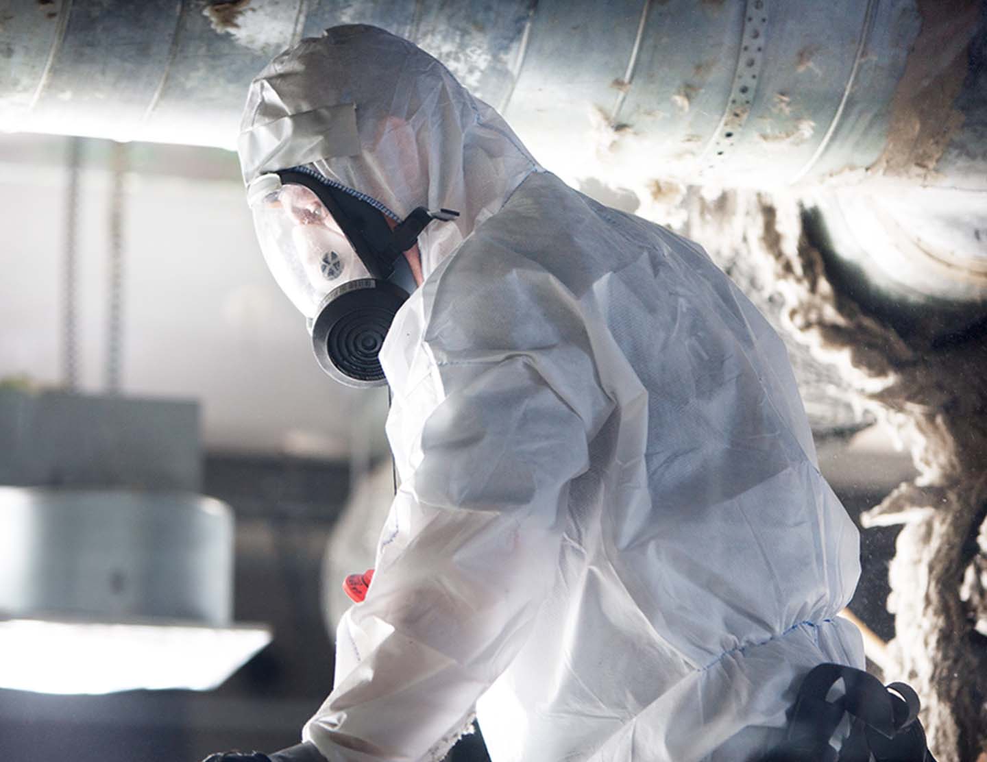 Ocab-personal med Asbestutrustning och mask